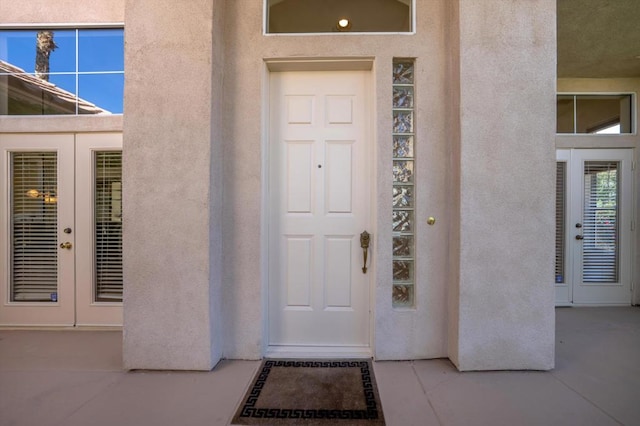 property entrance featuring french doors