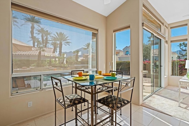 sunroom featuring lofted ceiling