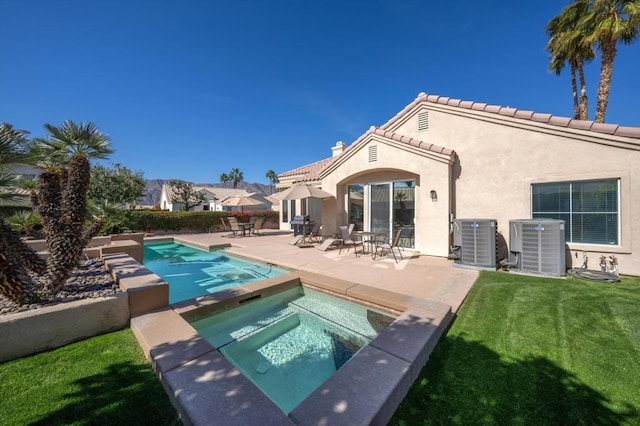 rear view of house featuring central AC, a patio area, a yard, and a pool with hot tub