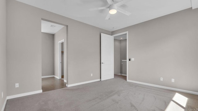 unfurnished bedroom with ceiling fan and carpet floors