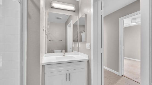 bathroom featuring tile patterned floors, a wall mounted AC, vanity, and toilet