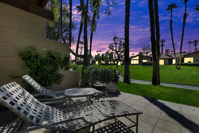 patio terrace at dusk with a yard