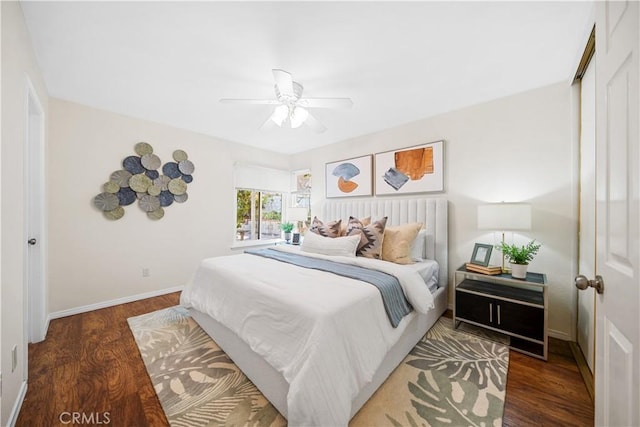 bedroom featuring dark hardwood / wood-style flooring and ceiling fan