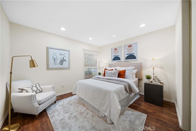 bedroom featuring dark hardwood / wood-style flooring