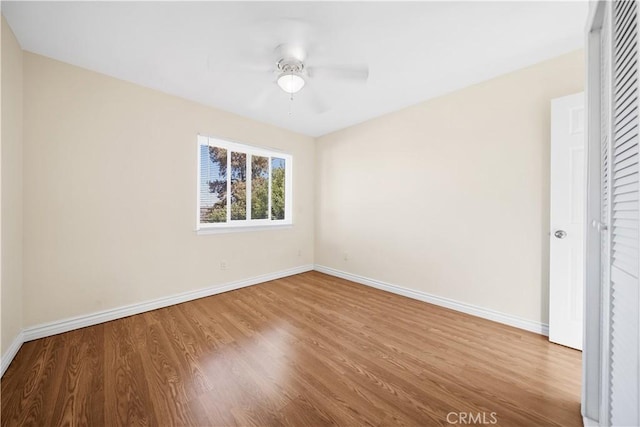 unfurnished bedroom featuring hardwood / wood-style flooring and ceiling fan