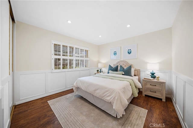 bedroom with a closet and dark wood-type flooring