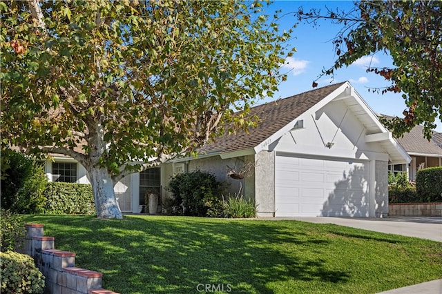 view of front of home featuring a garage and a front yard