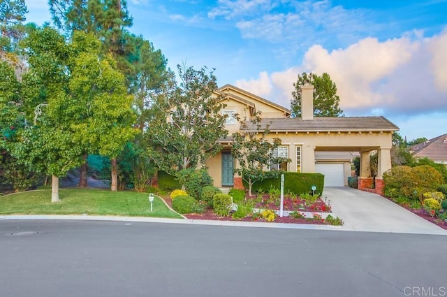 view of front of property with a yard and a garage