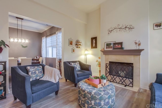 living area with hardwood / wood-style flooring and a fireplace