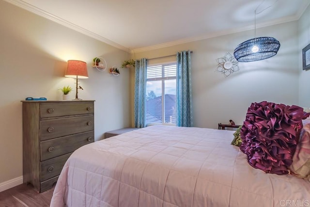 bedroom featuring hardwood / wood-style flooring and ornamental molding