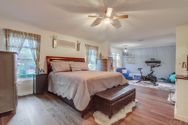 bedroom with hardwood / wood-style flooring and ceiling fan