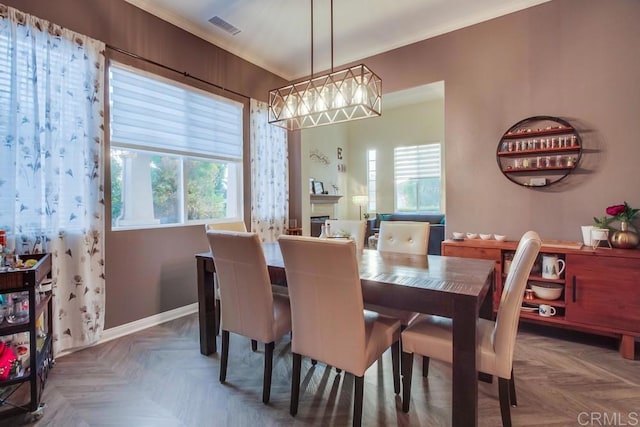 dining area featuring plenty of natural light and parquet floors