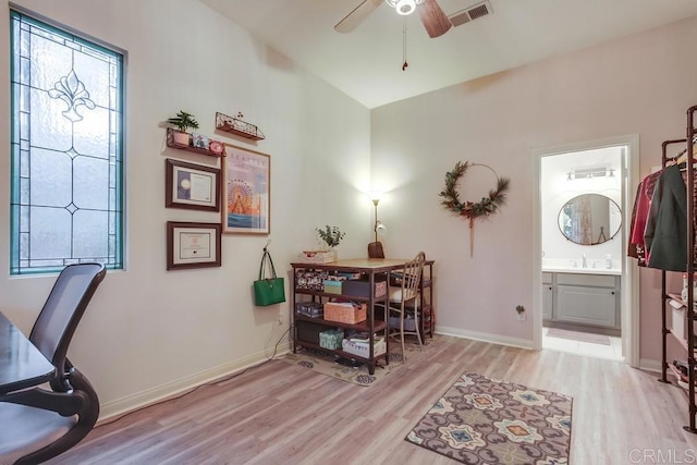 home office featuring ceiling fan and light wood-type flooring