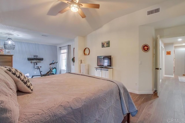 bedroom with ceiling fan and light hardwood / wood-style flooring