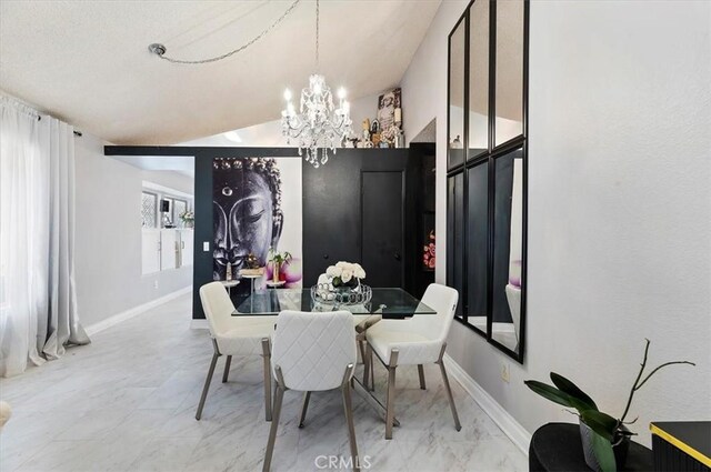 dining space with an inviting chandelier and vaulted ceiling