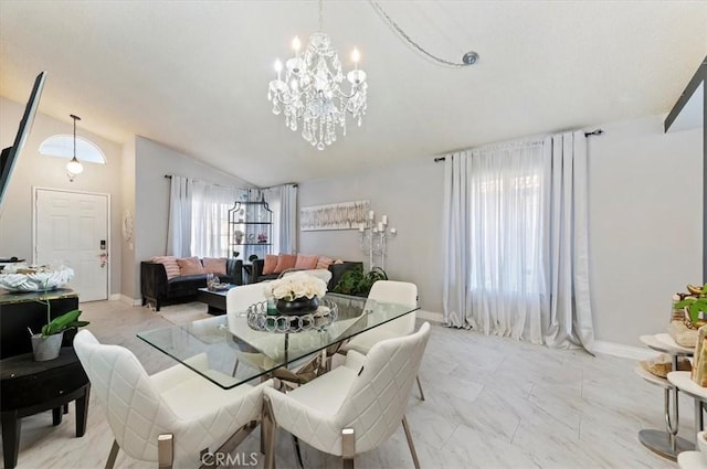 dining space with vaulted ceiling and a notable chandelier