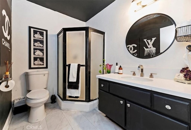 bathroom featuring vanity, toilet, and walk in shower