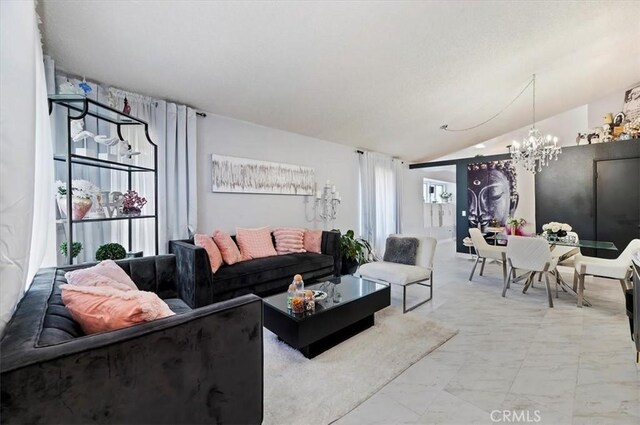 living room featuring vaulted ceiling and a notable chandelier