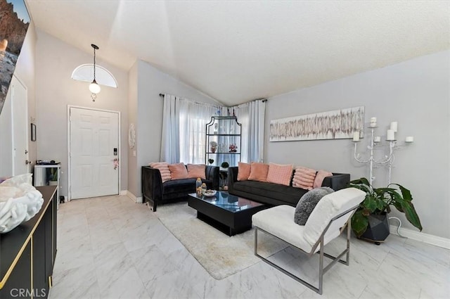 living room featuring vaulted ceiling