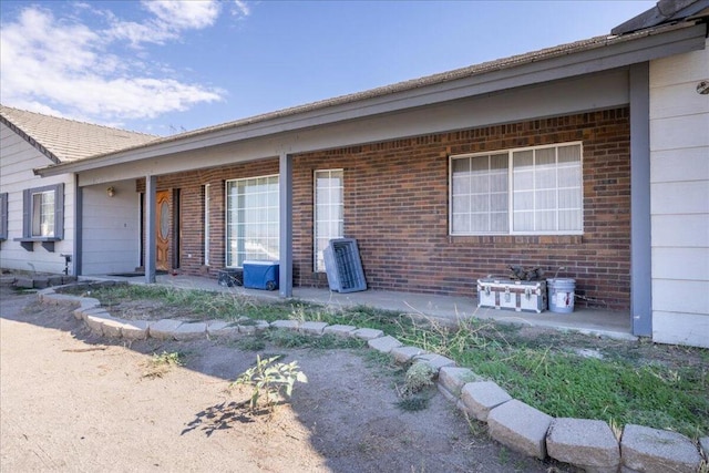 entrance to property with a patio area