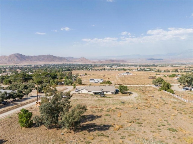 drone / aerial view with a mountain view and a rural view