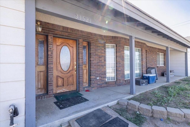 doorway to property with covered porch