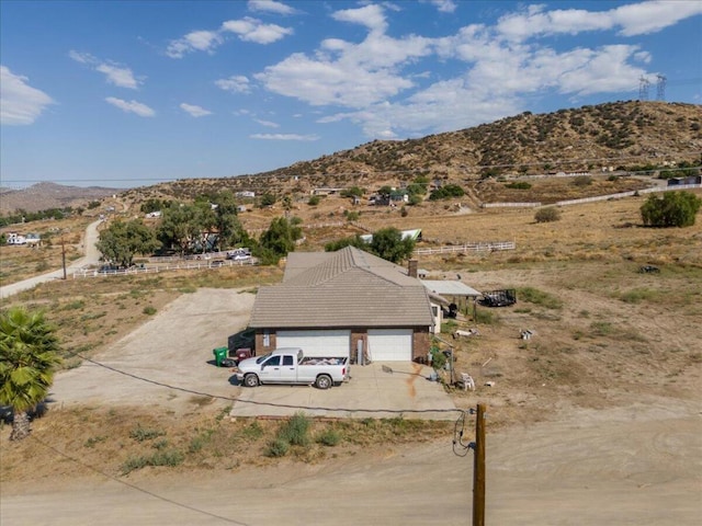 birds eye view of property with a mountain view