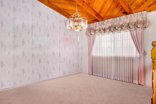 unfurnished room with carpet flooring, vaulted ceiling with beams, a notable chandelier, and wood ceiling