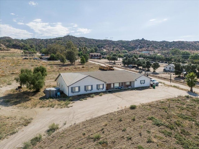 drone / aerial view with a mountain view and a rural view