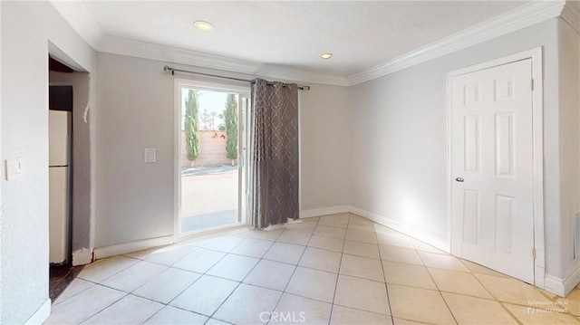 unfurnished room with light tile patterned floors and ornamental molding