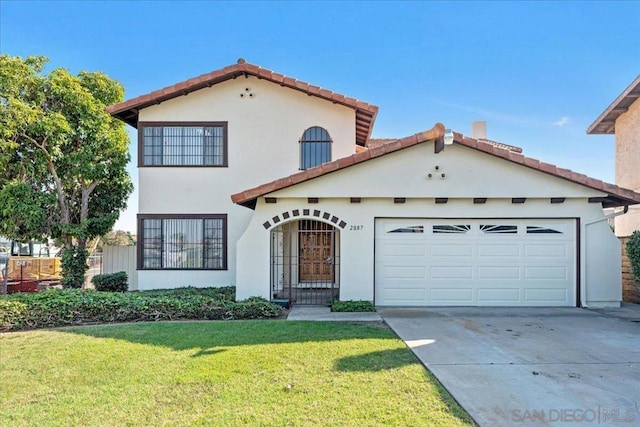 view of front of property featuring a front lawn and a garage