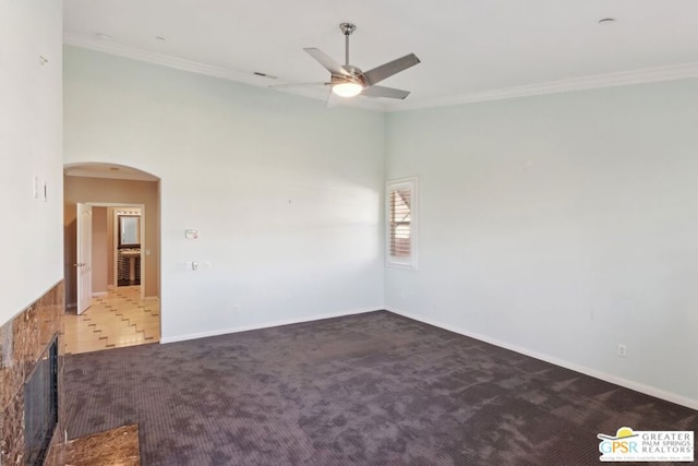 unfurnished room with ceiling fan, ornamental molding, and carpet floors