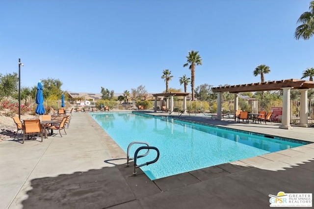 view of pool with a patio area and a pergola