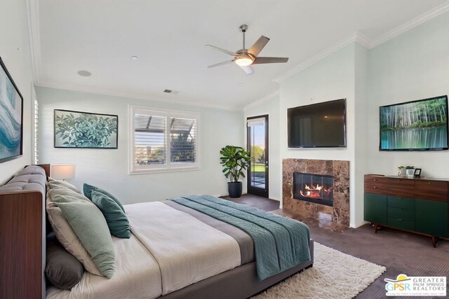 carpeted bedroom featuring lofted ceiling, ceiling fan, access to exterior, a fireplace, and ornamental molding