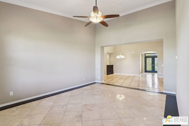 unfurnished room with crown molding, light tile patterned floors, and ceiling fan with notable chandelier