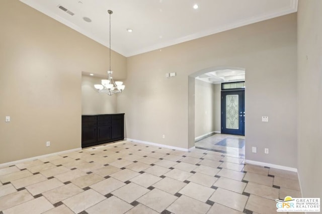 interior space featuring an inviting chandelier and crown molding