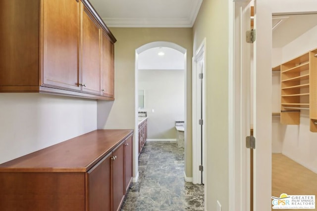 hallway featuring ornamental molding