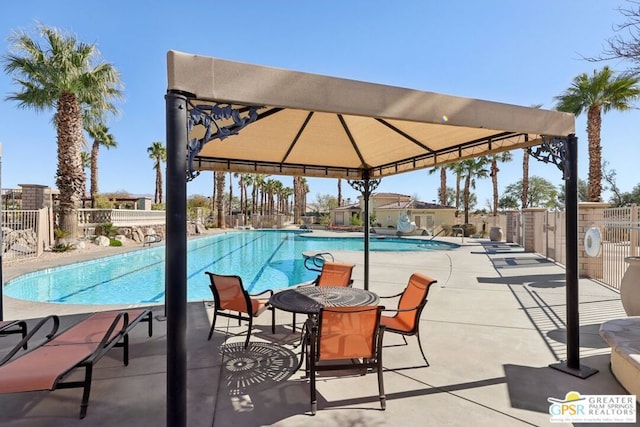 view of swimming pool with a gazebo and a patio