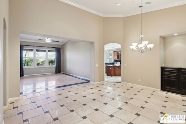 interior space featuring crown molding, light tile patterned flooring, and ceiling fan with notable chandelier