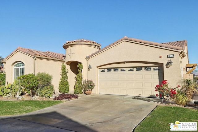 mediterranean / spanish home featuring a garage