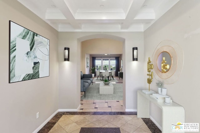 hall with coffered ceiling, tile patterned floors, ornamental molding, and beam ceiling