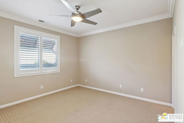 carpeted spare room featuring crown molding and ceiling fan