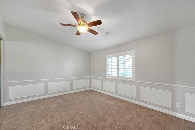 carpeted empty room with ceiling fan