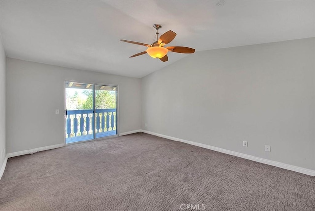 carpeted empty room featuring ceiling fan and lofted ceiling