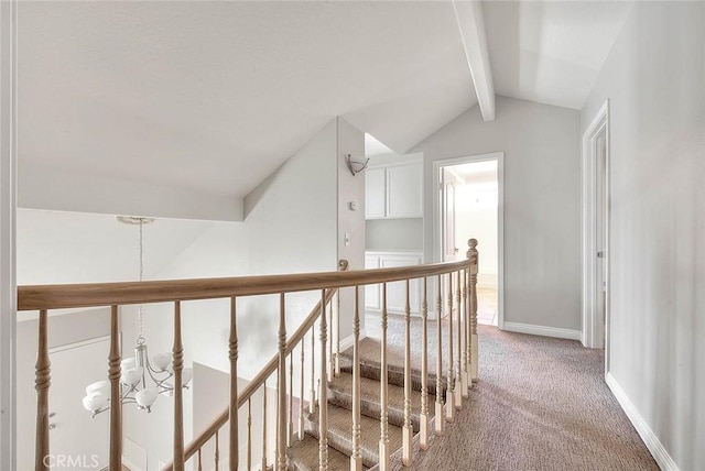 hall with carpet floors and lofted ceiling with beams