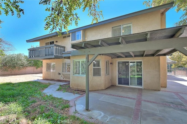 back of property with a patio area