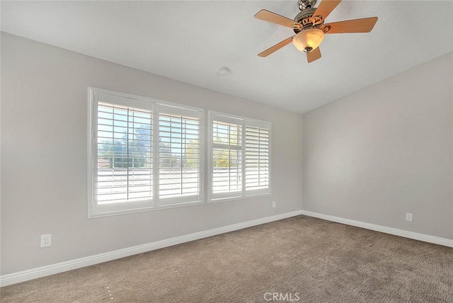 empty room featuring ceiling fan and carpet floors