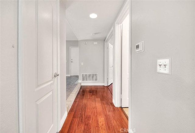 corridor featuring hardwood / wood-style flooring