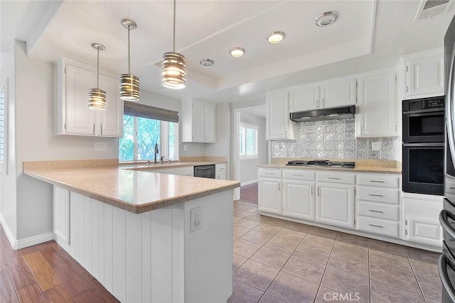 kitchen with kitchen peninsula and white cabinets