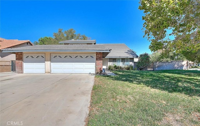 view of front of property with a front lawn and a garage